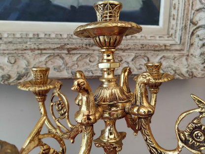 Paire de candélabres en bronze doré et onyx, style Restauration avec décor de tête d'aigle